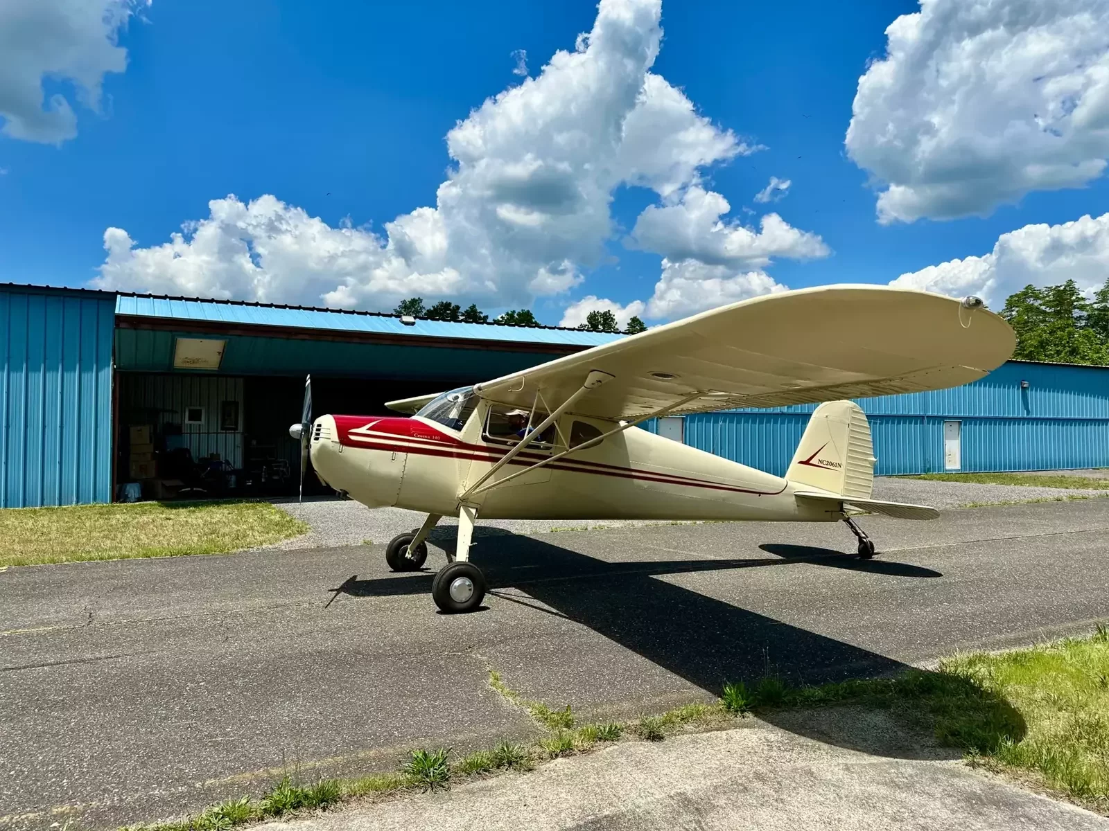 Cessna 140 N2061N outside a hangar