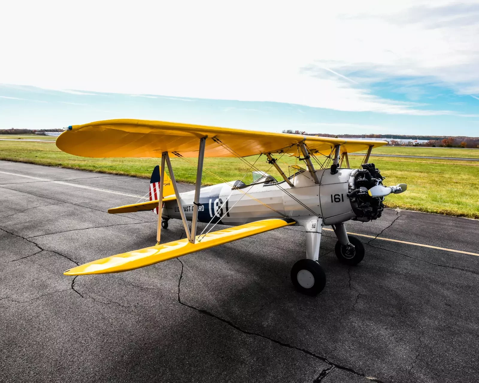 1942 Boeing PT-17 Stearman N73449 with yellow wings and U.S. Coast Guard livery