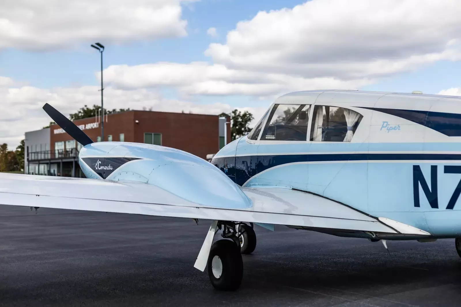 VSFT Twin Comanche beside the terminal at Warrenton-Fauquier Airport